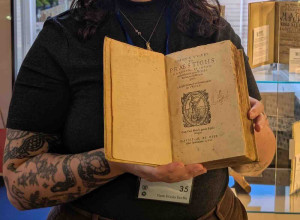 Clare Marshall of Marshall Rare Books with the expanded edition of Johann Weyer's Praestigiis Daemonum, Et Incantationibus ac ueneficiis